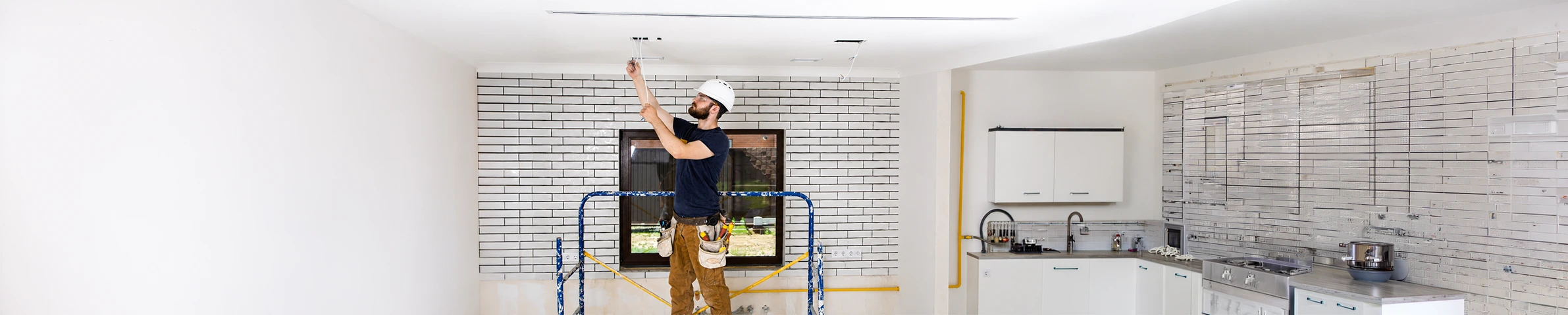 An electrician fault-finding and repairing a domestic circuit in South West London