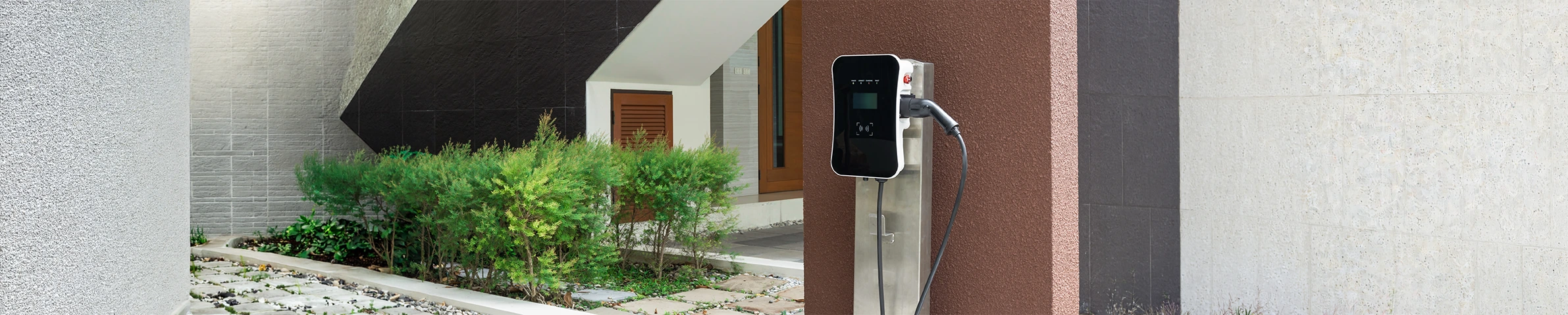 A home EV charger wired in on its own circuit with a tidy weatherproof cable run, on a Steel Electrical job in Surrey